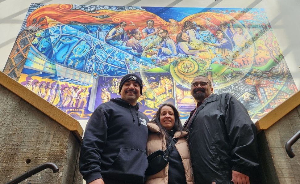 Peer Mentors in front of artwork at SFSU.