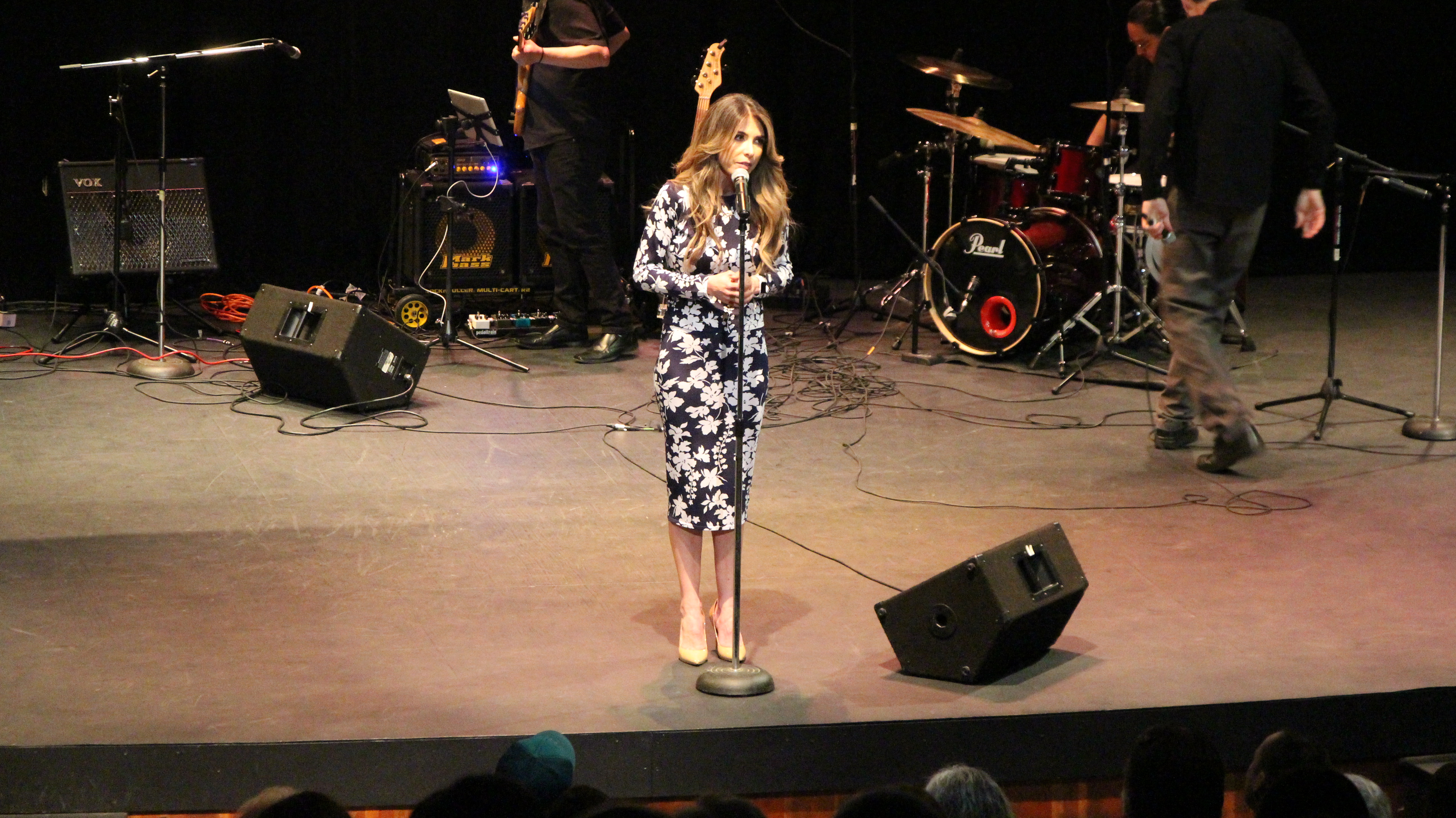 Maria Amirkhanian on stage at Bach to Blues speaking at the mic