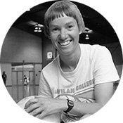 Black and white image of Susan Dodd with a volleyball